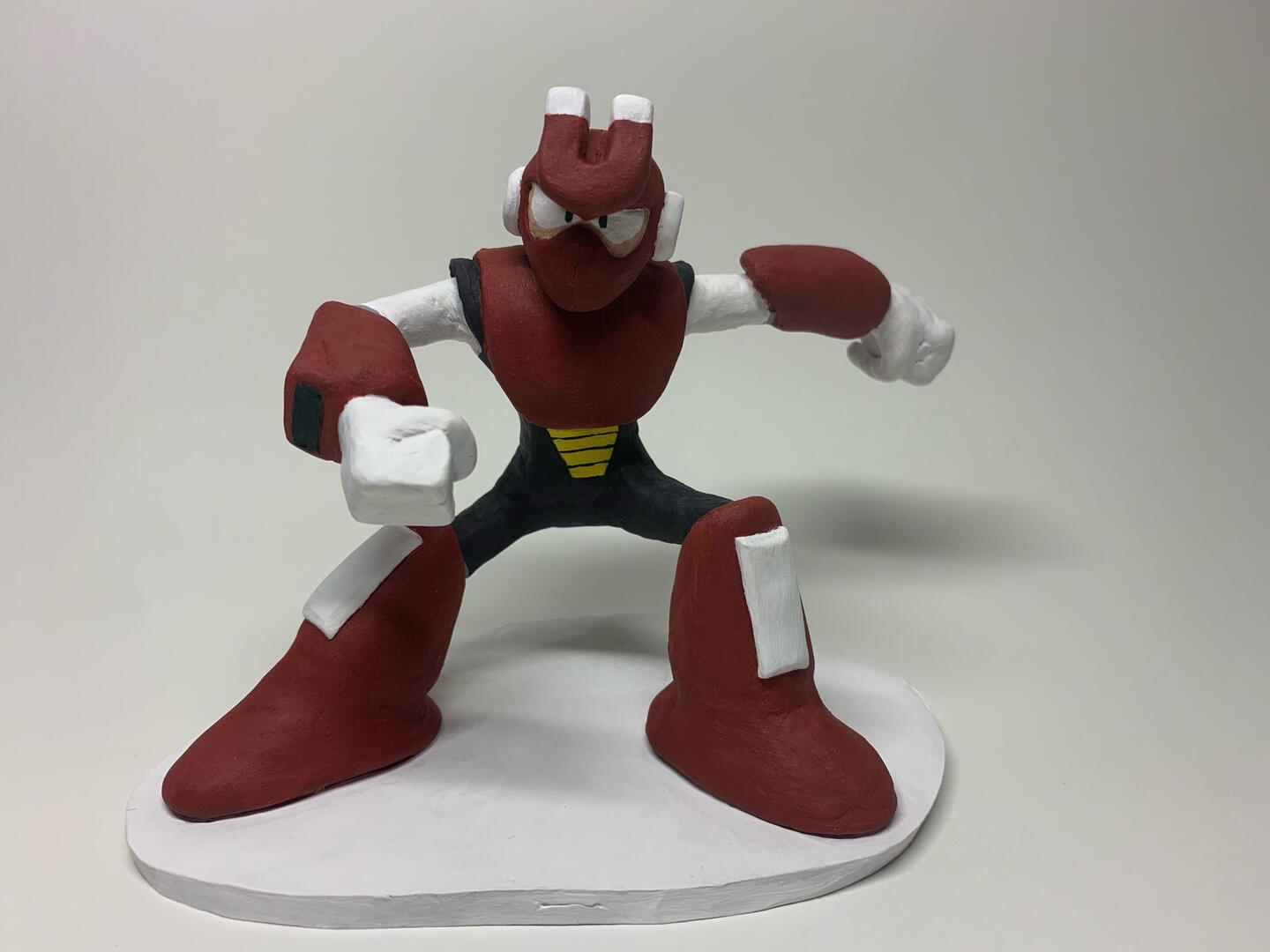 a clay figure of magnet man on a white background